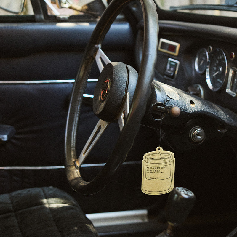 P.F. Candle Co. Air Freshener 2-Pack in Golden Coast, air freshener hanging in a car