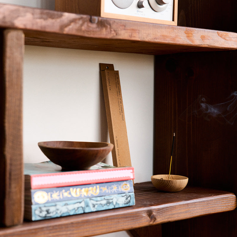 P.F. Candle Co. Incense Sticks in Ojai Lavender burning on a wood shelf