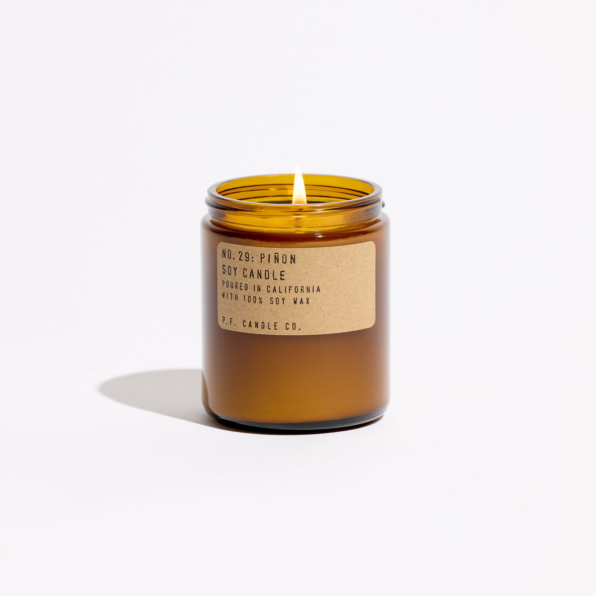 P.F. Candle Co. Standard Candle in Piñon, 7.2 oz amber glass jar with brass lid