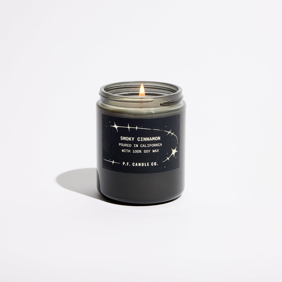 P.F. Candle Co. Celestial Collection Candle in Smoky Cinnamon, smoky grey glass jar with black lid