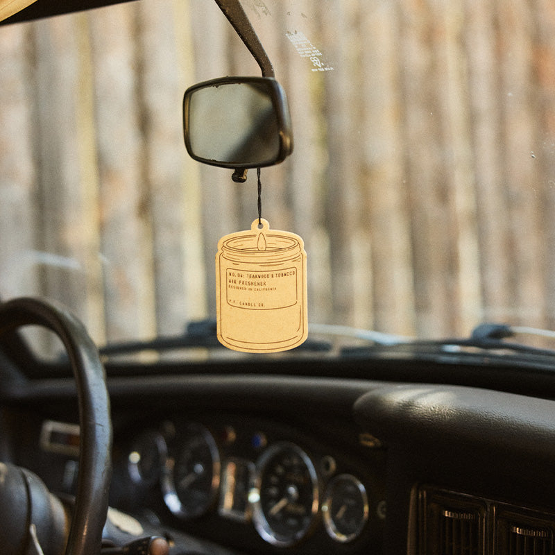P.F. Candle Co. Air Freshener 2-Pack in Teakwood & Tobacco, air freshener hanging in a car