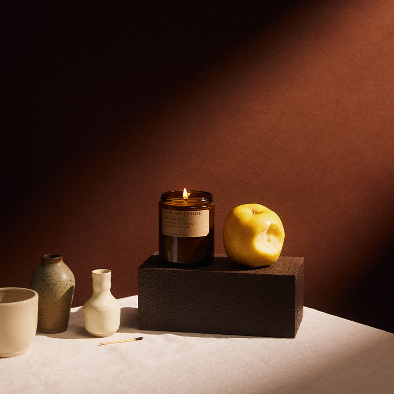 P.F. Candle Co. Standard Candle in Apple Picking styled with ceramics and an apple
