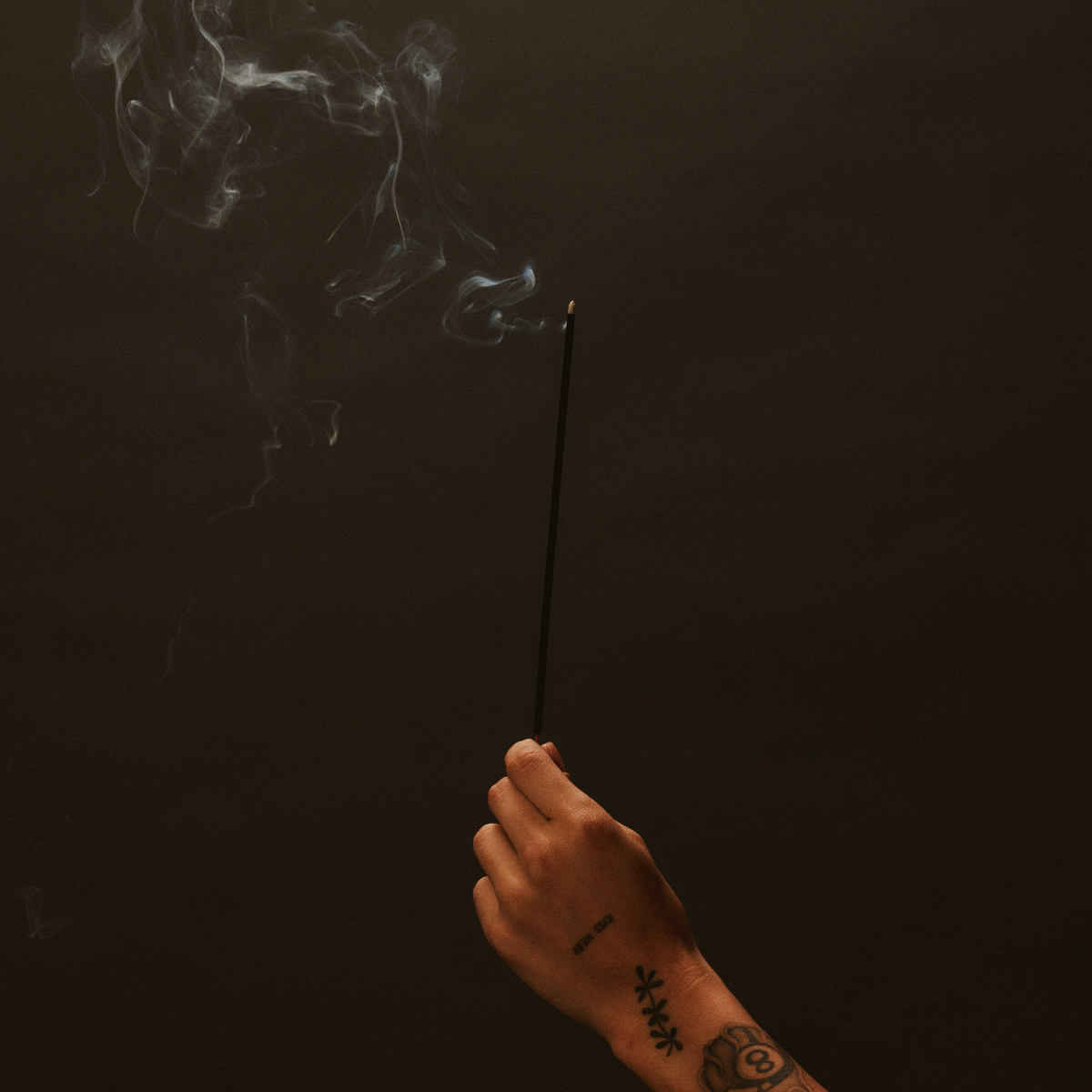 P.F. Candle Co. Incense Stick burning with a tendril of smoke
